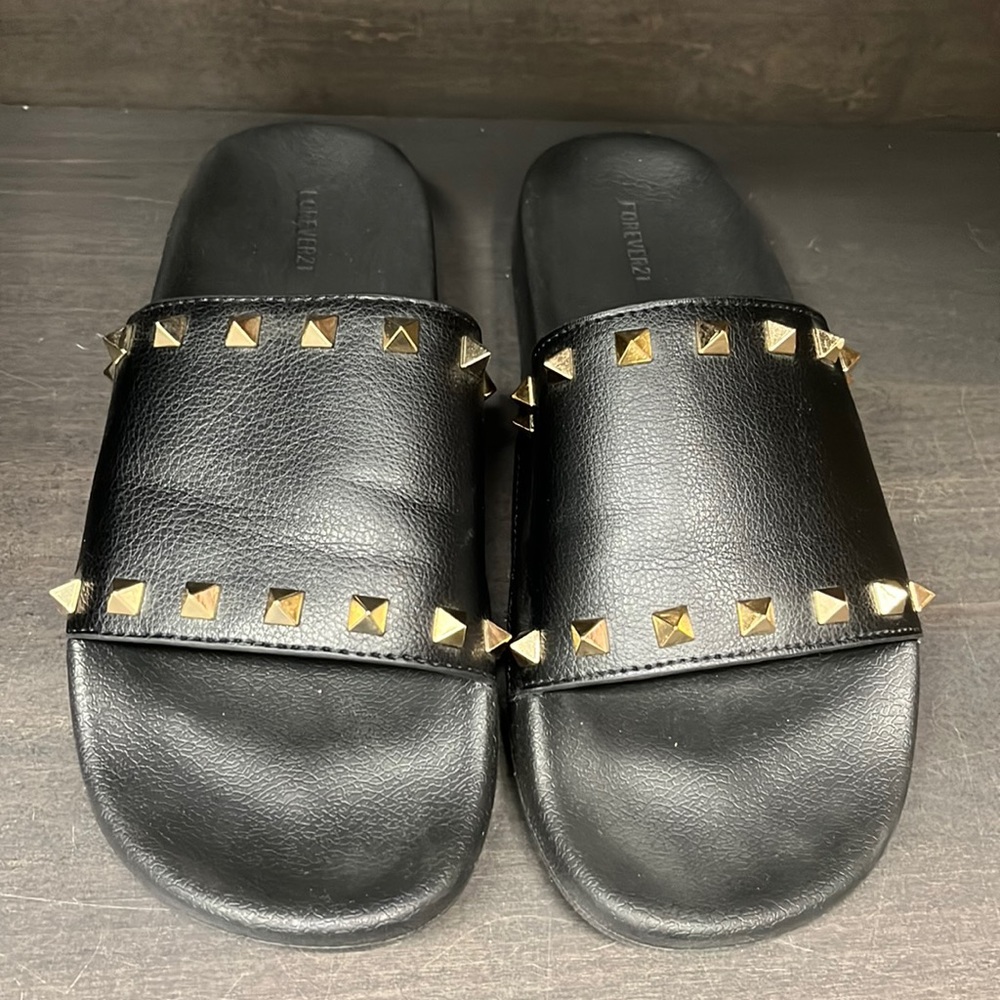 Black slides with gold studs. Women’s size 7.